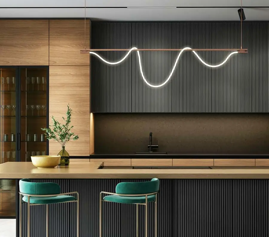 Contemporary kitchen with dark fluted panels, timber and green velvet stools