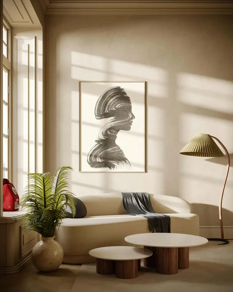 Sunlit lounge with a framed brushstroke portrait