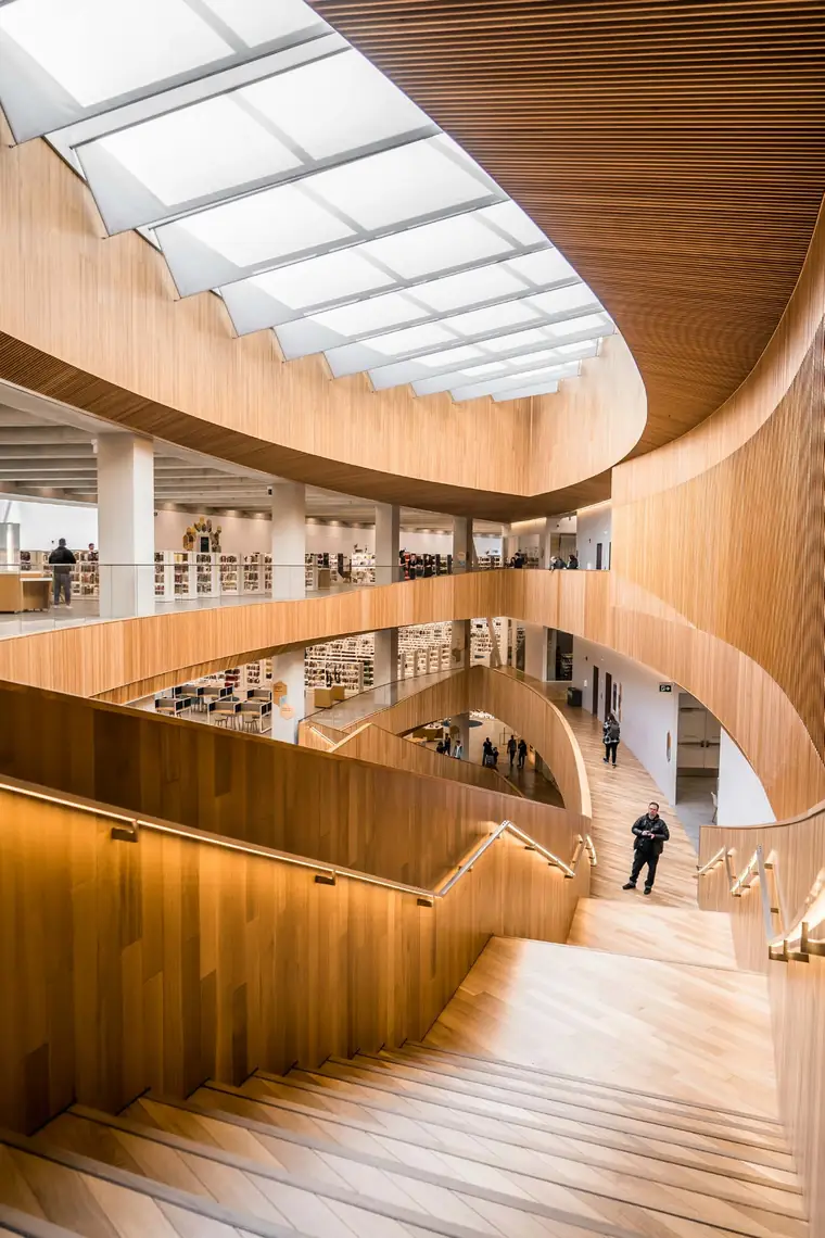 Multi-level library with curved timber balustrades