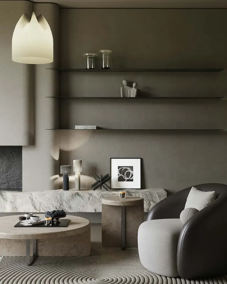 Built-in stone shelving lit by a soft pendant