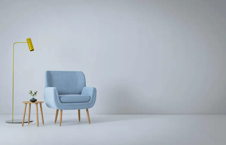 Pale blue armchair with a timber side table